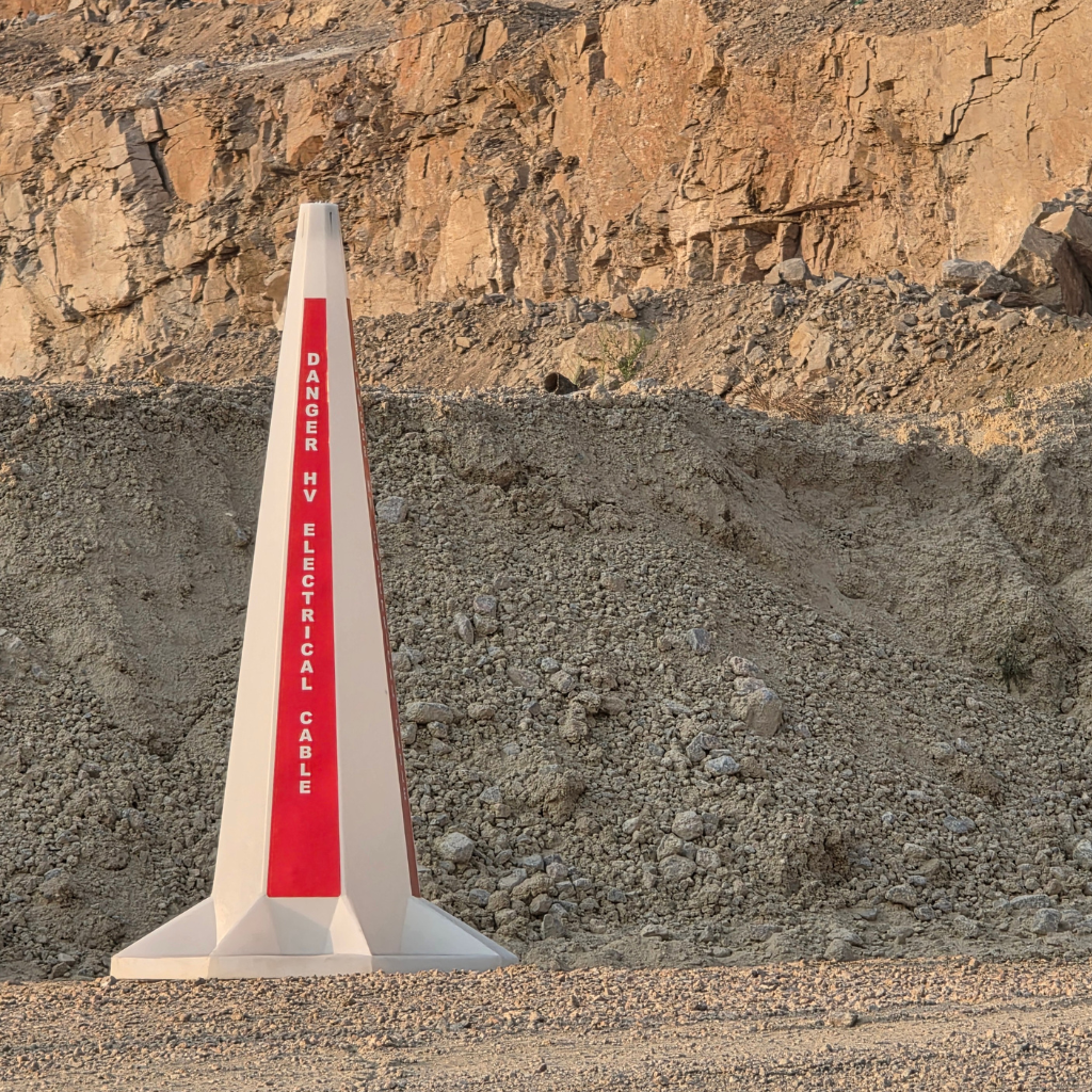 Solar Flashing cone at daytime with the message _Danger HV Electrical Cable