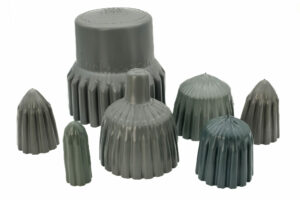 Assorted grey ribbed stemming plugs in multiple sizes, arranged on a white background.